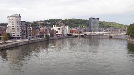 river meuse on a cloudy summer day in the city of liège, belgium.