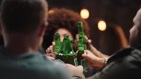 diverse group of friends making toast having fun drinking socializing hanging out in bar chatting sharing celebration enjoying evening reunion gathering