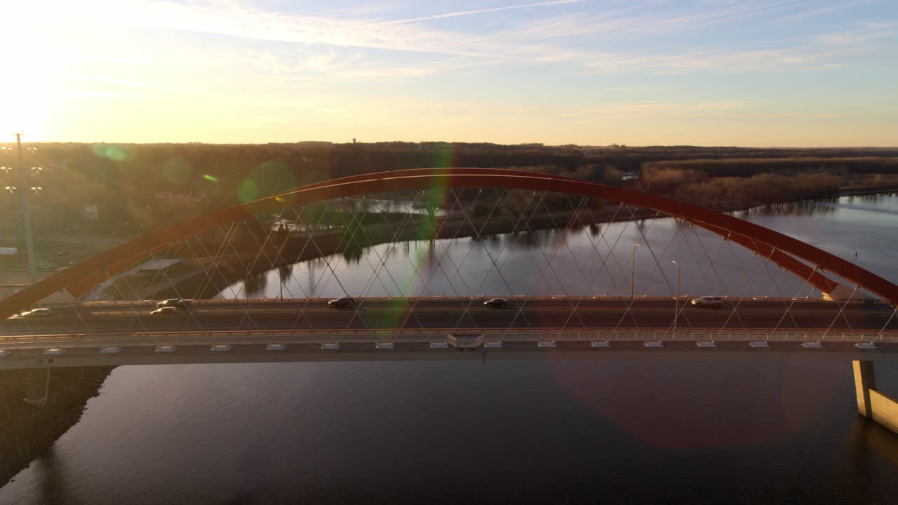 Aerial View of a Red Arch Bridge at Sunset