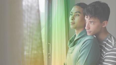 embracing by window, couple with rainbow light animation