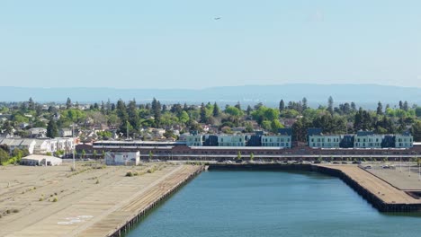 a left to right aerial sliding shot of apartment complexes in the alameda neighborhood of mariner square.