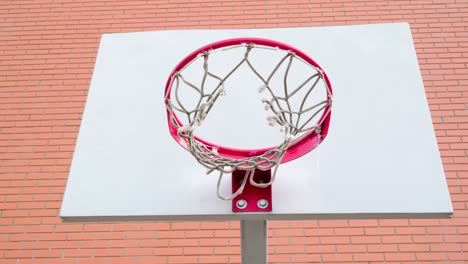 the broken net of the basketball ring