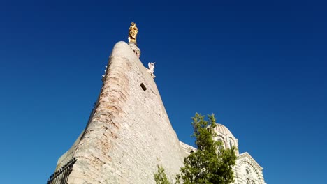 Famous-historic-landmark-Notre-Dame-de-la-Garde-in-France,-cinematic-movement