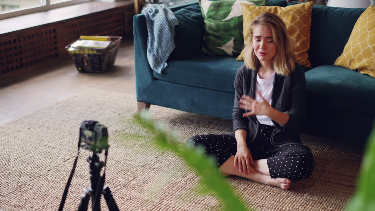 Young Woman Doing a Video Blog in Her Living Room