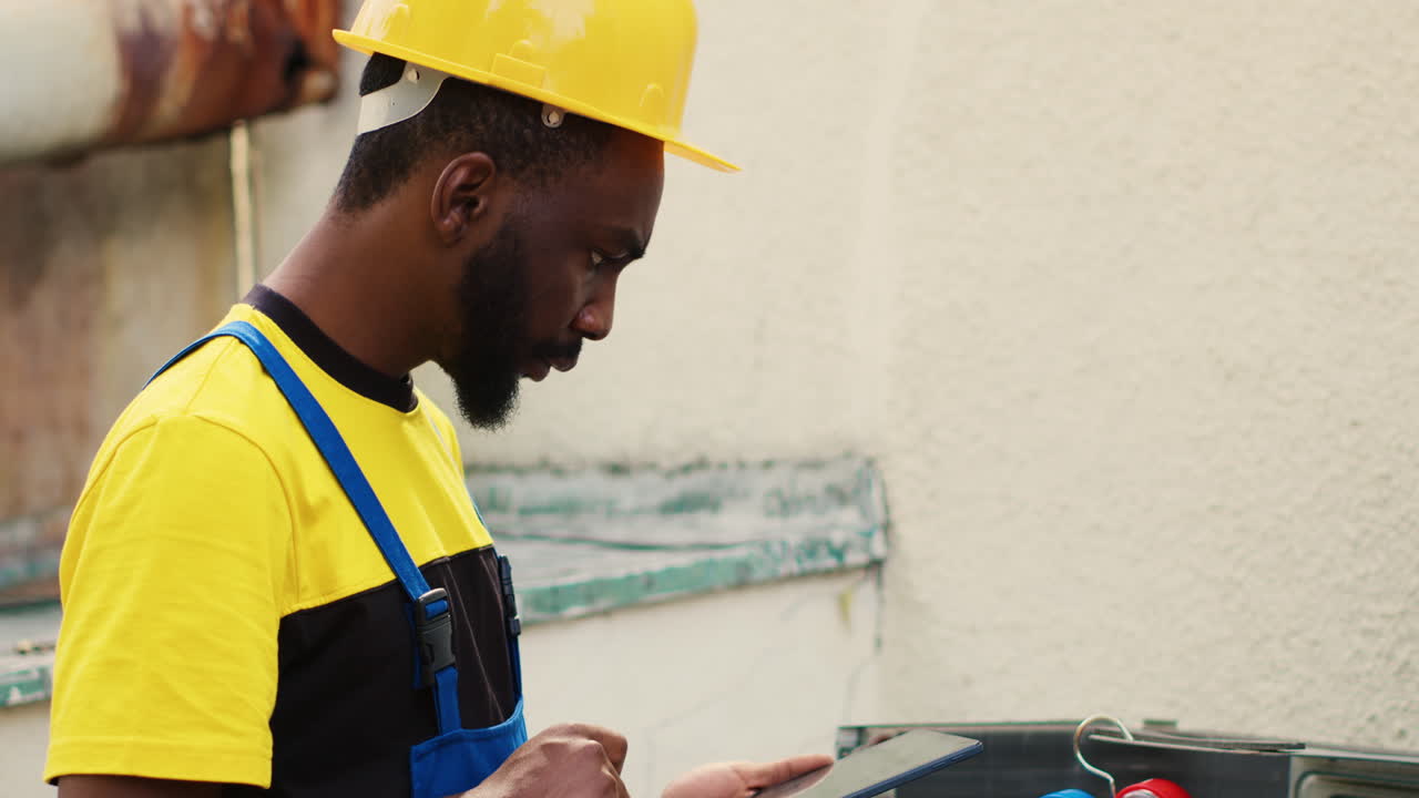 Repairman inspecting refrigerant levels