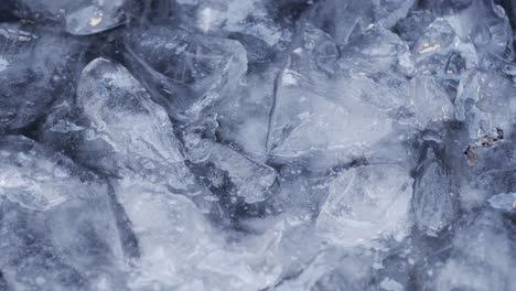 cold ice water moving in a lake with ice chunks floating