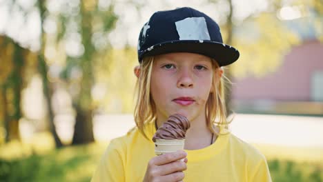 kid eating ice cream in park