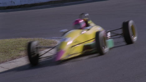 a formula car drives on a circuit track 11