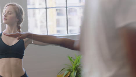 young business women practice yoga meditation together in diverse office doing warrior pose enjoying mindfulness exercise relaxing on lunch break creative trendy workplace