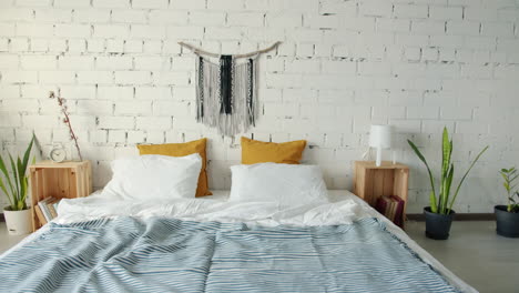 modern boho bedroom with white brick wall