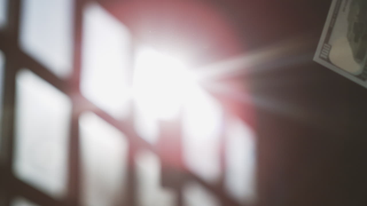 billete colgado en una ventana dólar