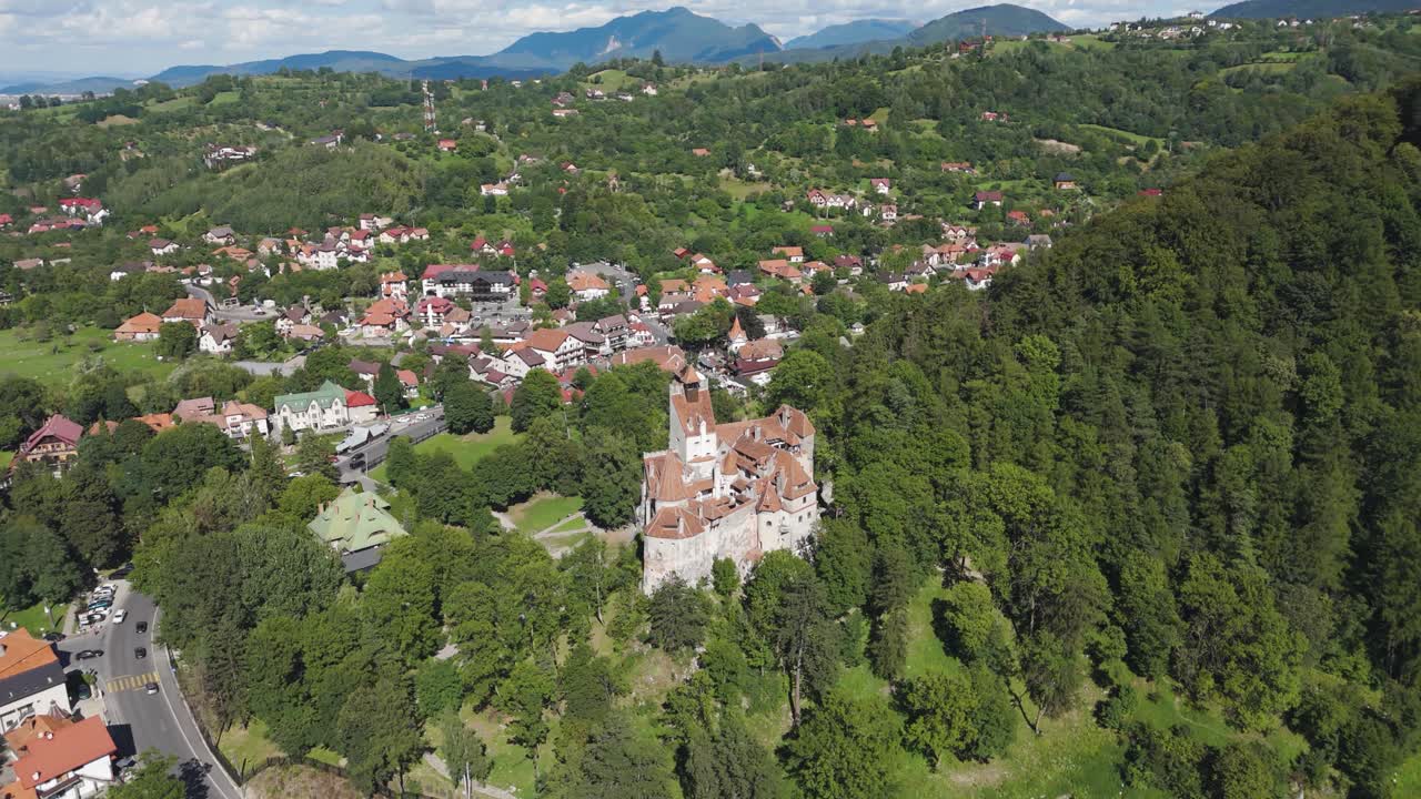 Aerial view highlighting Bran Castle and its scenic surroundings in Transylvania