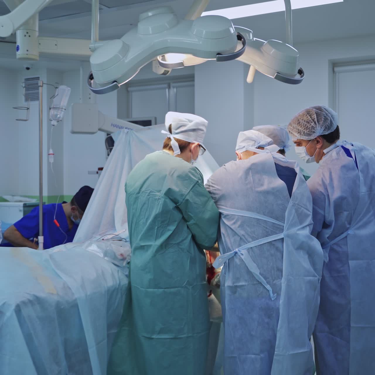 Surgical professional doctors in emergency room. Surgeon specialists working in group