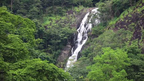 Namtok-Sarika-Waterfall-in-Nakhon-Nayok,-Thailand-in-dense-foilage-and-surround-trees-with-rocks