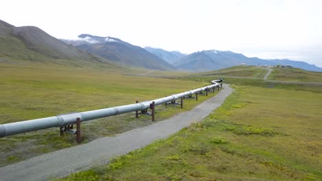 trans-alaskan pipeline for oil in alaska countryside - aerial drone flyover