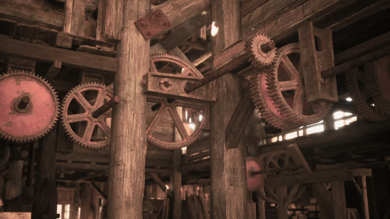 Rustic gears and machinery inside an old wooden workshop in the afternoon