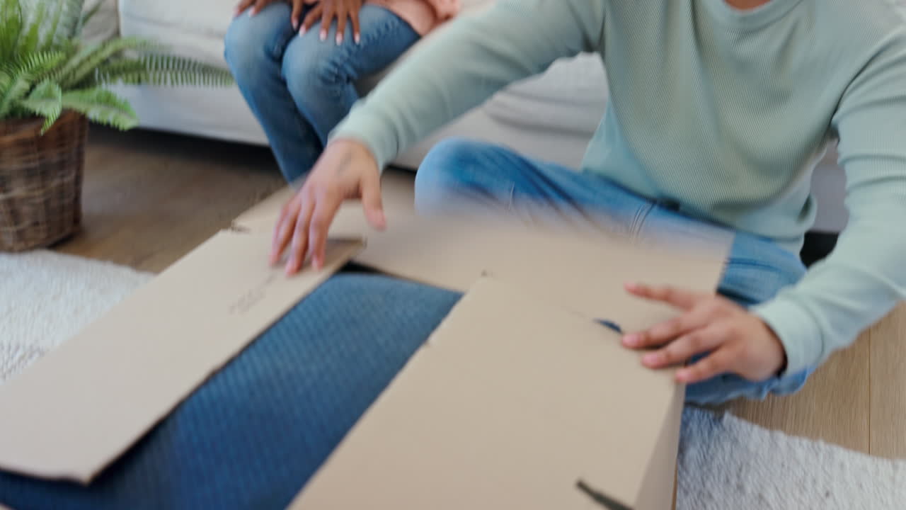 Property, moving house and couple packing a box