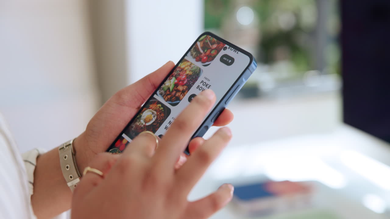Close-up of Hands Scrolling Through Food Delivery App on Smartphone