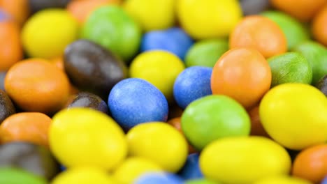 chocolate coated peanuts on a rotating table (seamless loopable)