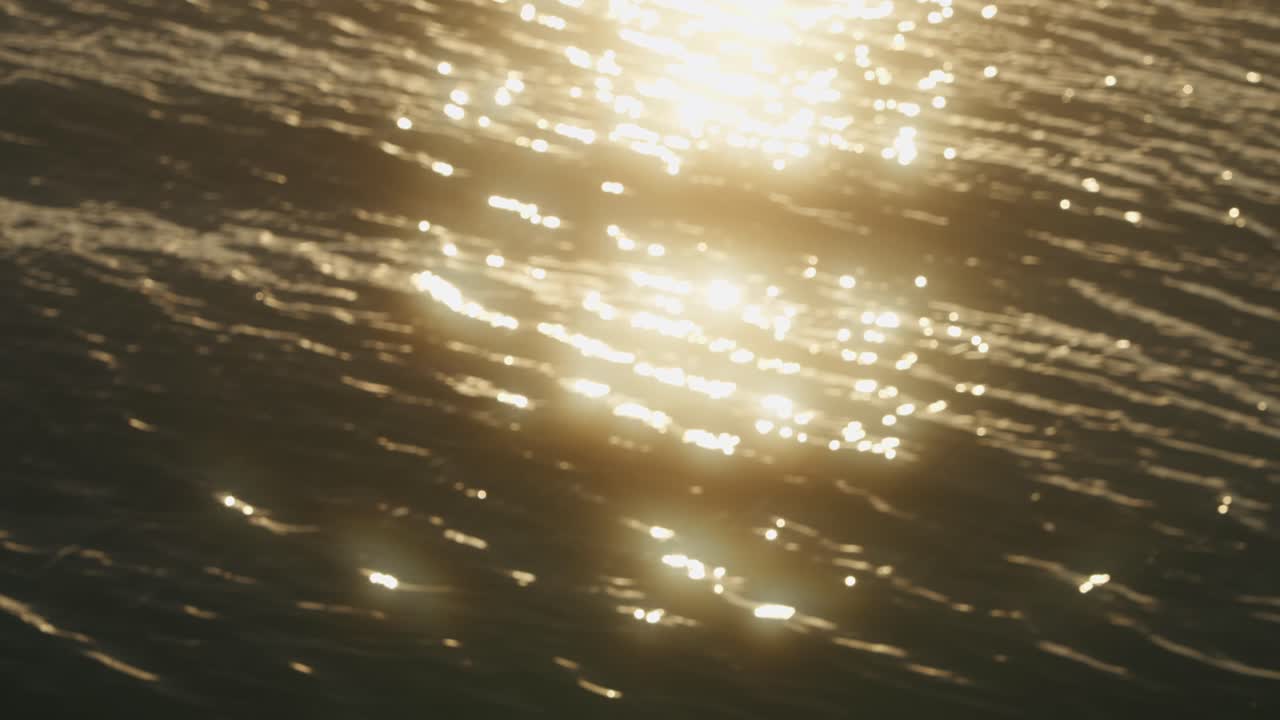 Magical sparkles of sunlight reflecting in water during sunset, creating golden shimmering diamonds in the ripples of the water. Dreamy, cinematic abstract scene with warm light and calming motion