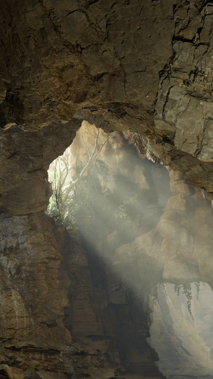 Light shining through cave opening reveals nature inside the rock formation