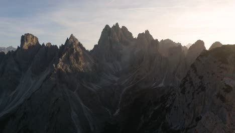 drone flies over hikers enjoying beautiful view in italy's dolomites mountain range