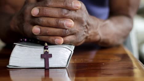 man-praying-to-God-with-hand-on-bible-with-people-stock-video-stock-footage