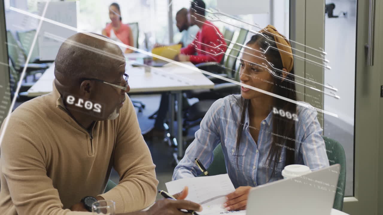 Colleagues discussing work at office with data processing animation overlay