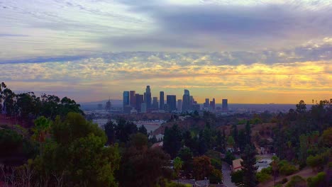 Flying-away-from-the-Los-Angeles-skyline-and-a-beautiful-sunset