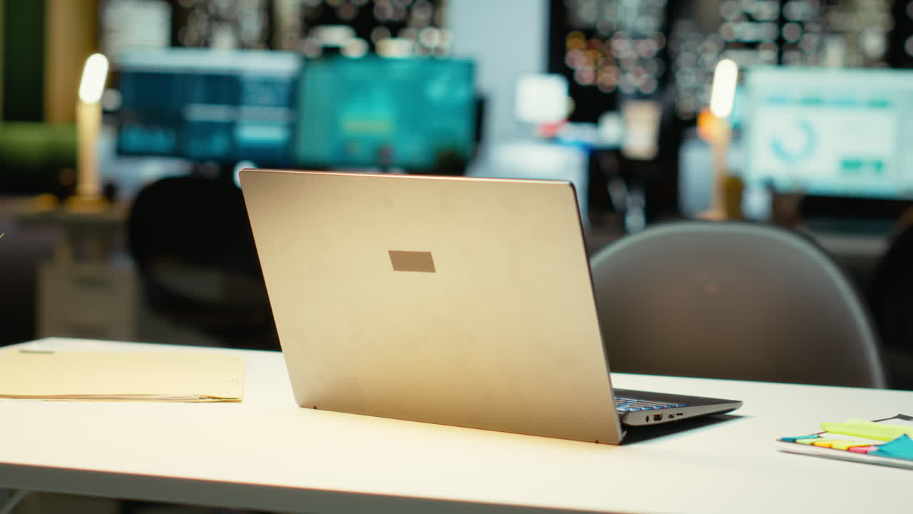 High end empty office features laptop and monitors for forecasting