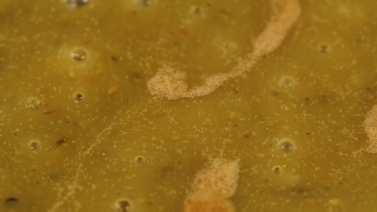 Cooking traditional Indian meal Palak Panir with spinach and cheese close up. Palak paneer is an Indian dish, consisting of paneer in a thick paste made from pureed spinach, Palak paneer is prepared by first boiling and pureeing spinach.