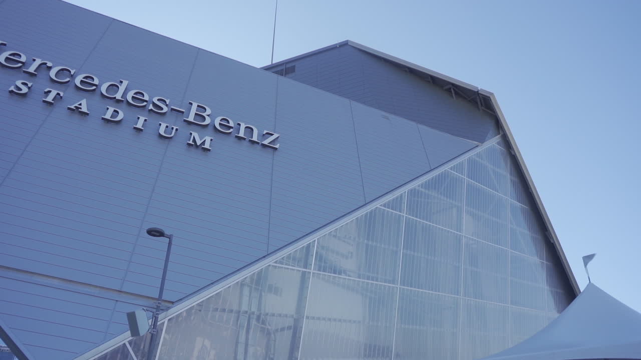 This is a panning revealing shot of the Mercedes-Benz Stadium and its logo.