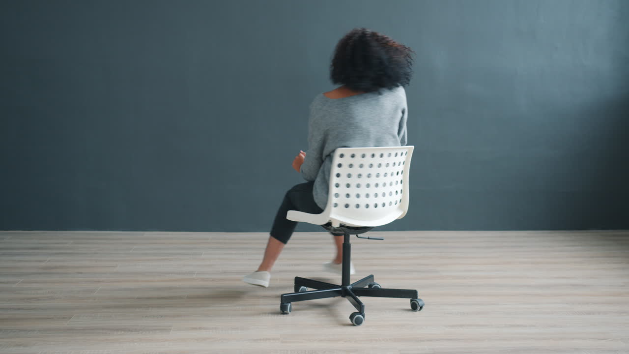 Woman Dancing in a Chair