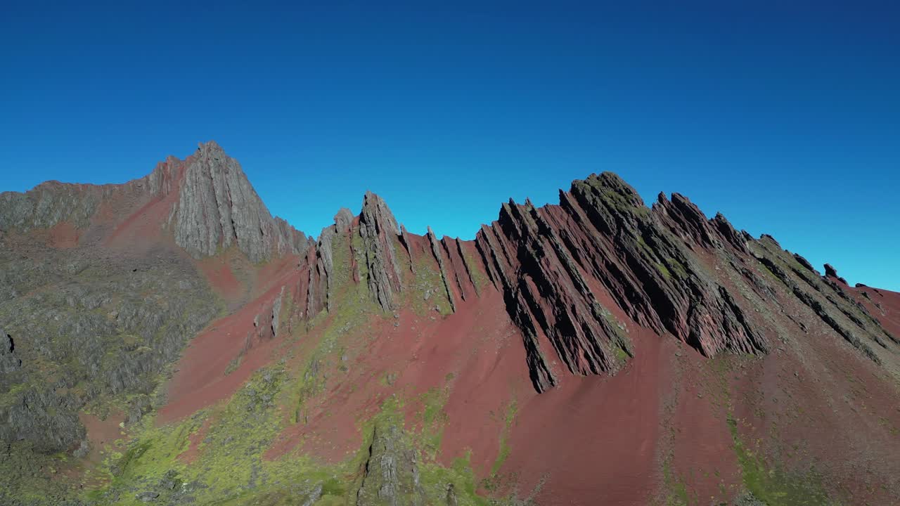Beautiful high-altitude drone footage from the Peruvian Andes near Rainbow Mountain. Red earth, wide horizons, and untouched wilderness