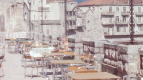 Historic Center of Budva Cafe Tables with Few People Seated Montenegro 1960s