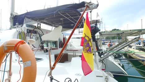 flag of spain on a pleasure boat in the port of denia