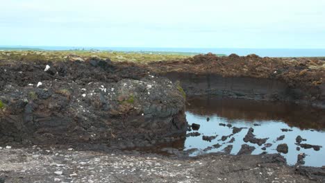 Inside-a-peat-pit-in-the-Outer-Hebrides,-peat-is-used-traditionally-for-winter-fires