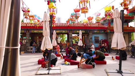 people gathered at colorful temple courtyard