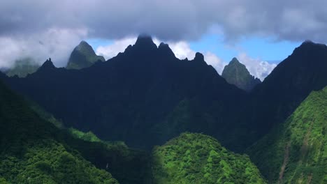 vallee de tautira river valley bay vaitepiha villageteahupoo tahiti island french polynesia aerial drone jagged mountain aorai peak aorai taiarapu taravao north shore cloudy parallax backwards motion