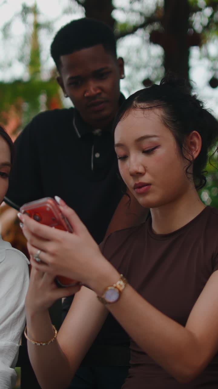 People using smartphones outdoors