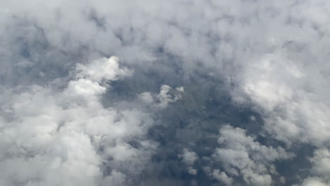 thick heavenly clouds view from plane's window. aerial