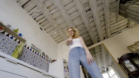 woman in a kitchen with a unique ceiling