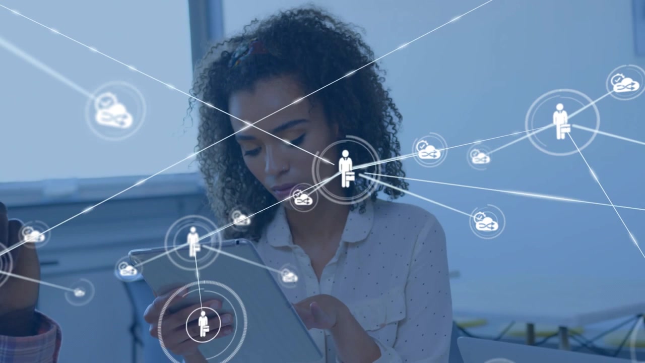 Woman tapping tablet in tech office, making network icons over tablet and head mapping team links