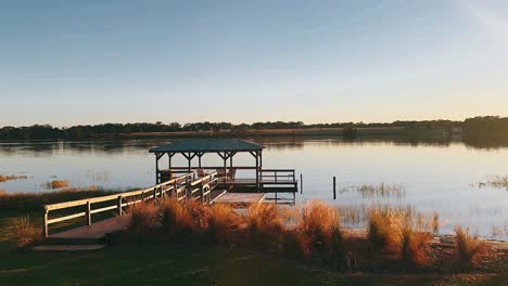 peaceful lakeside gazebo at sunrise/sunset