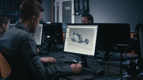 Students learning 3D modeling in a computer lab