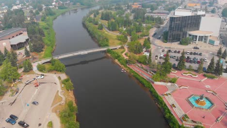 4k drone video of the chena river viewpoint bridge in downtown fairbanks, alaska during summer day