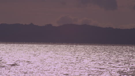 Clouds-moving-fast-over-a-beautiful-lake-at-sunset-in-Verazruz,-Mexico