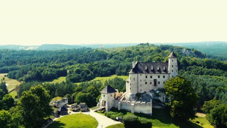 bobolice medieval castle in a green land landscape aerial view