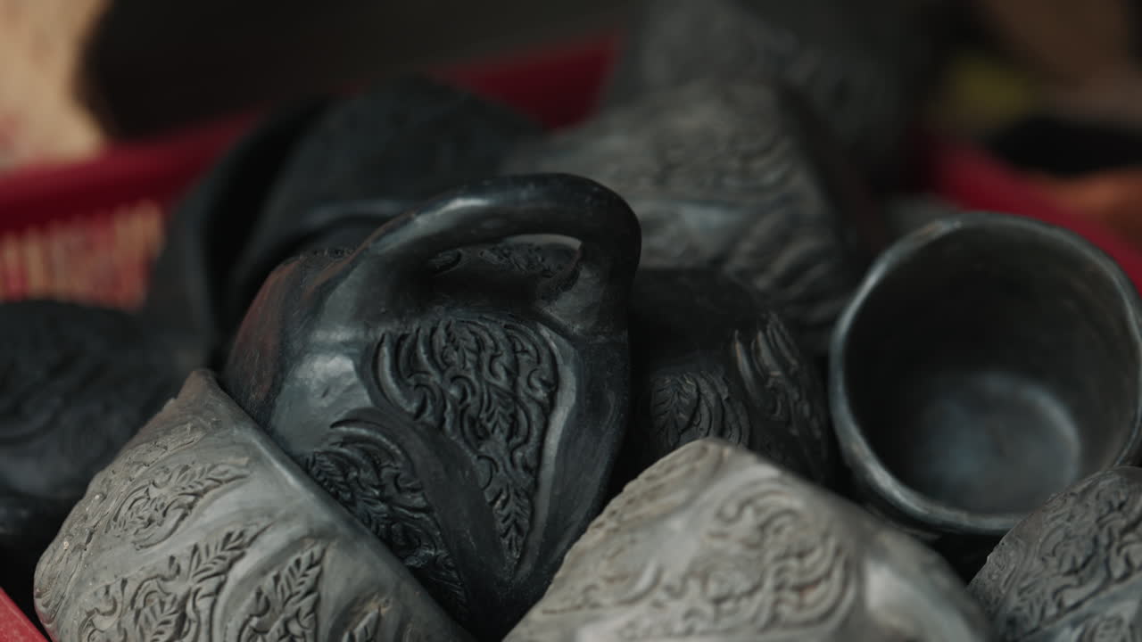 Assortment of Decorative Hand-Carved Black Pottery Cups