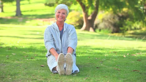 Mature-woman-doing-her-stretches-outdoors